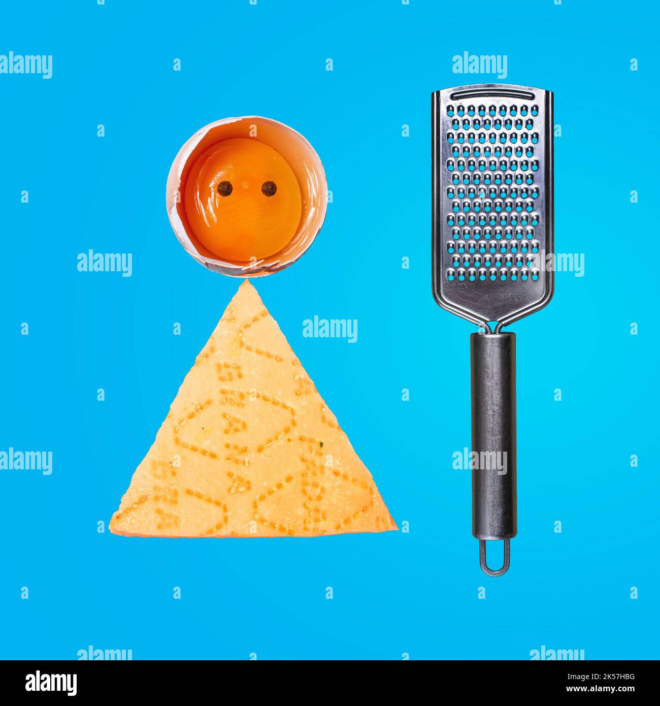Modern concept concept. Egg and Parmesan man with a cheese grater. Idea for business, marketing and advertising. Copy the background. Place for text Stock Photo