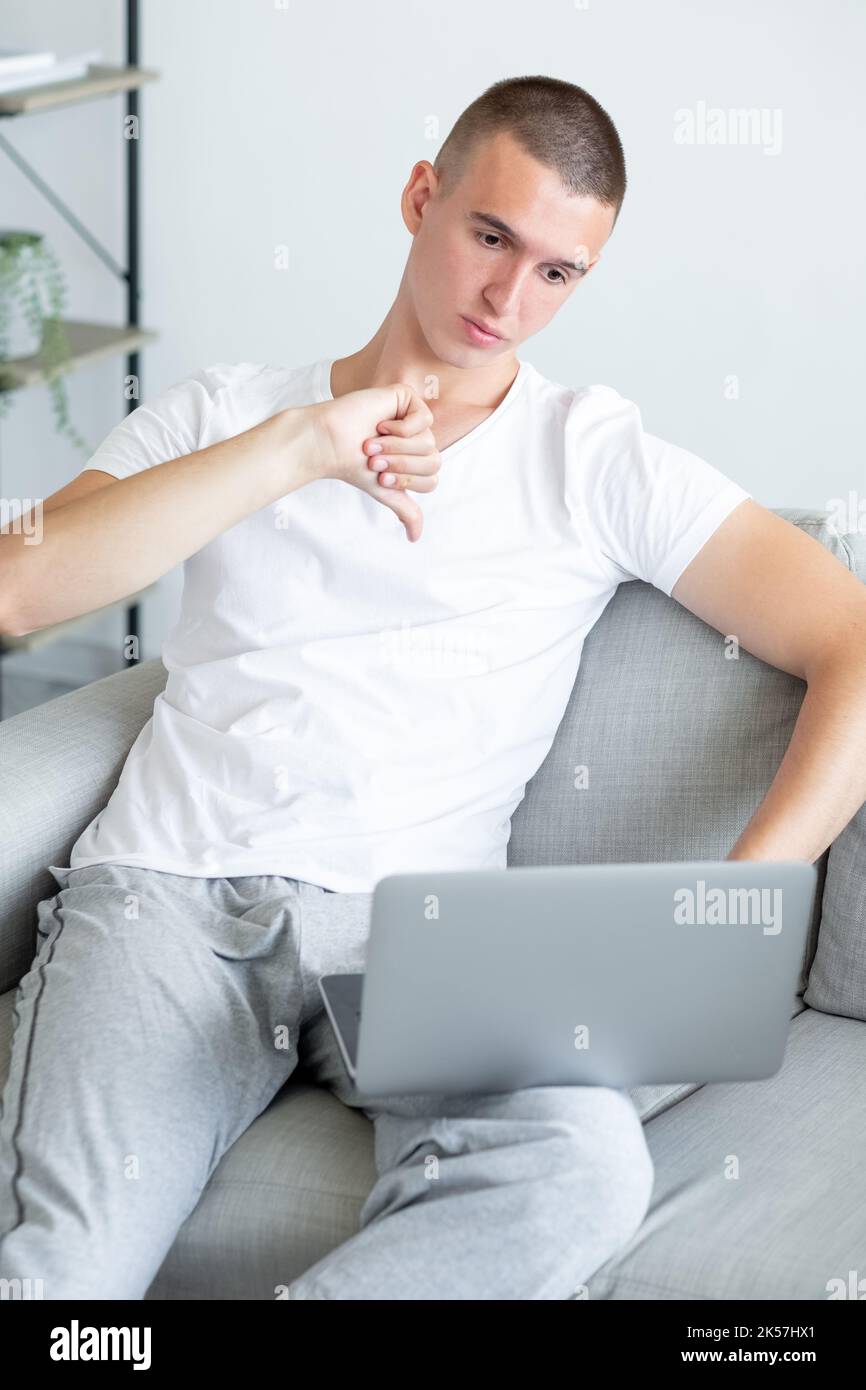 dislike gesture unhappy man bad internet sad Stock Photo