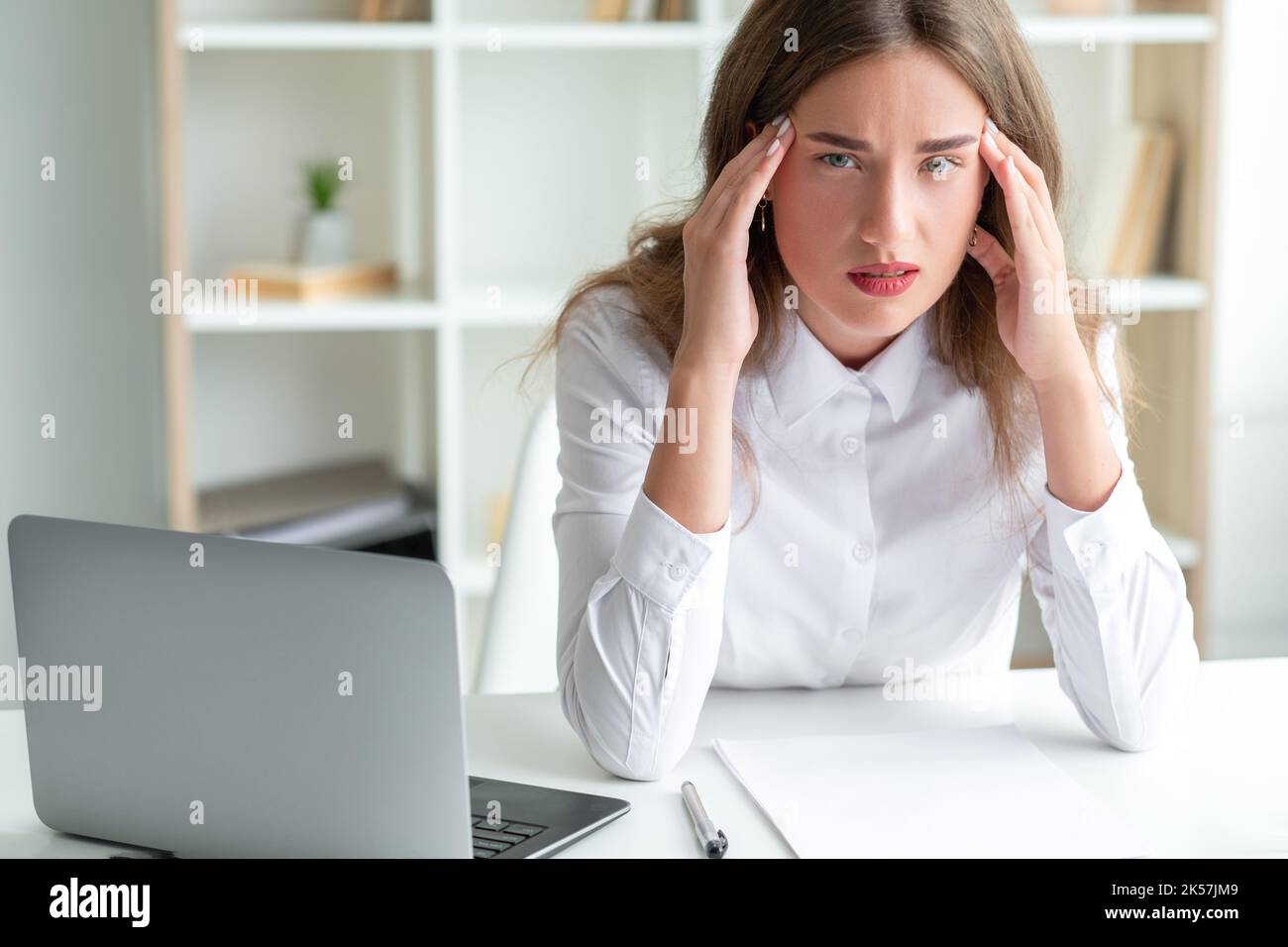 office work exhausted woman consider problem Stock Photo Alamy