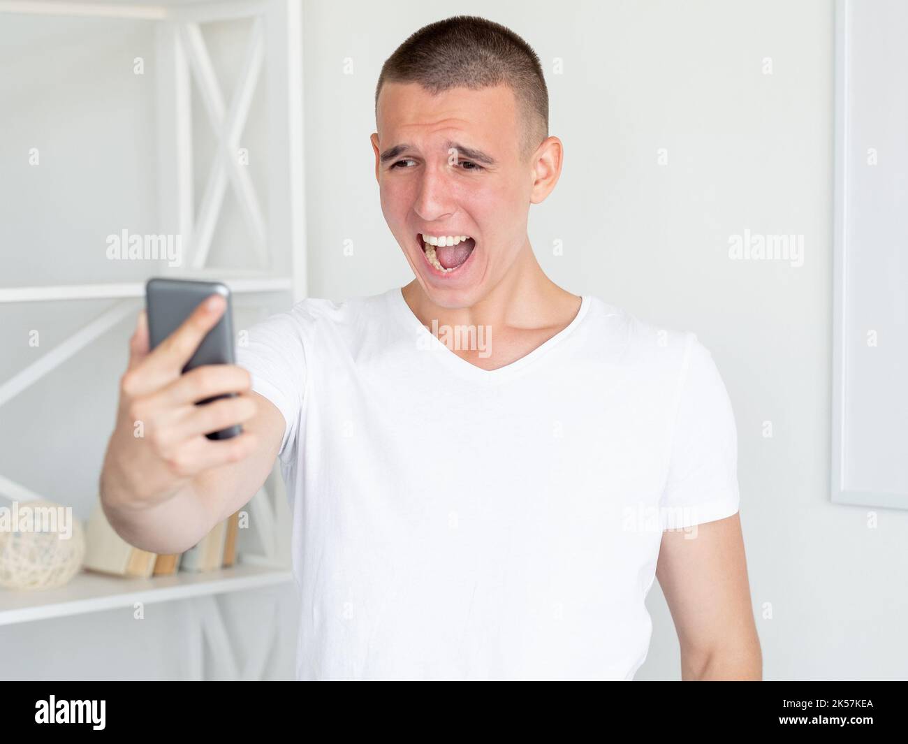 screaming man virtual connection angry emotion Stock Photo