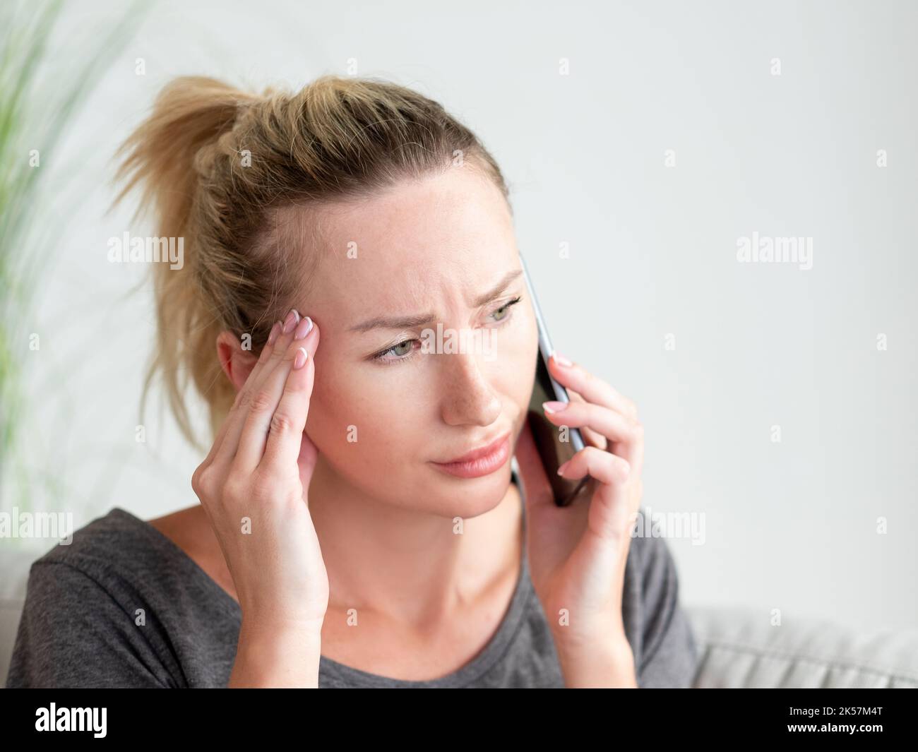 bad news exhausted woman psychology support Stock Photo