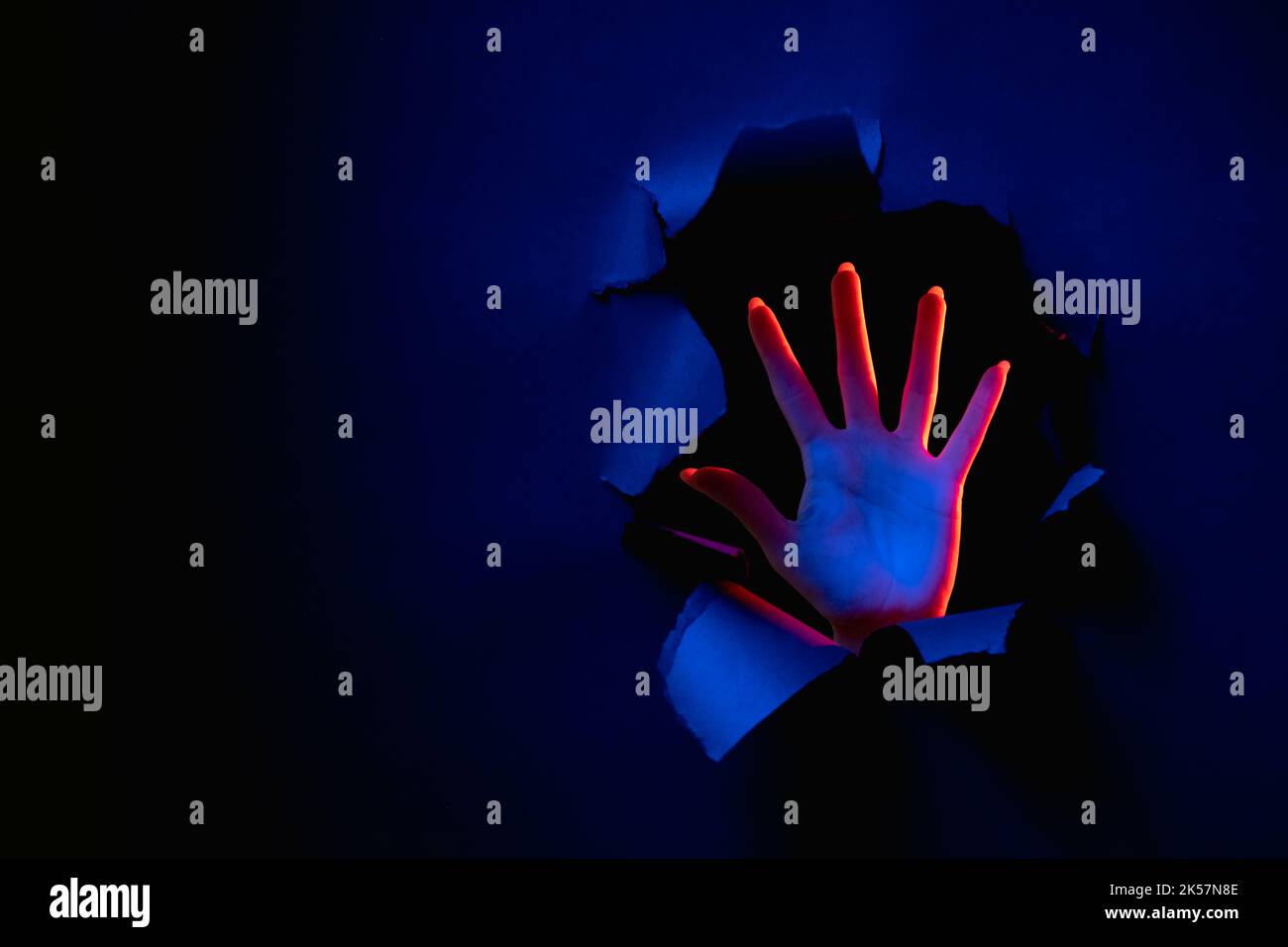 night fear anxiety panic hand palm breakthrough Stock Photo