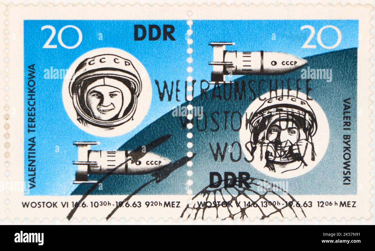 Photo of two East German postage stamps featuring illustrations of cosmonauts Valentina Tereschkowaa and Valeri Bykowski and rockets 1963 Stock Photo
