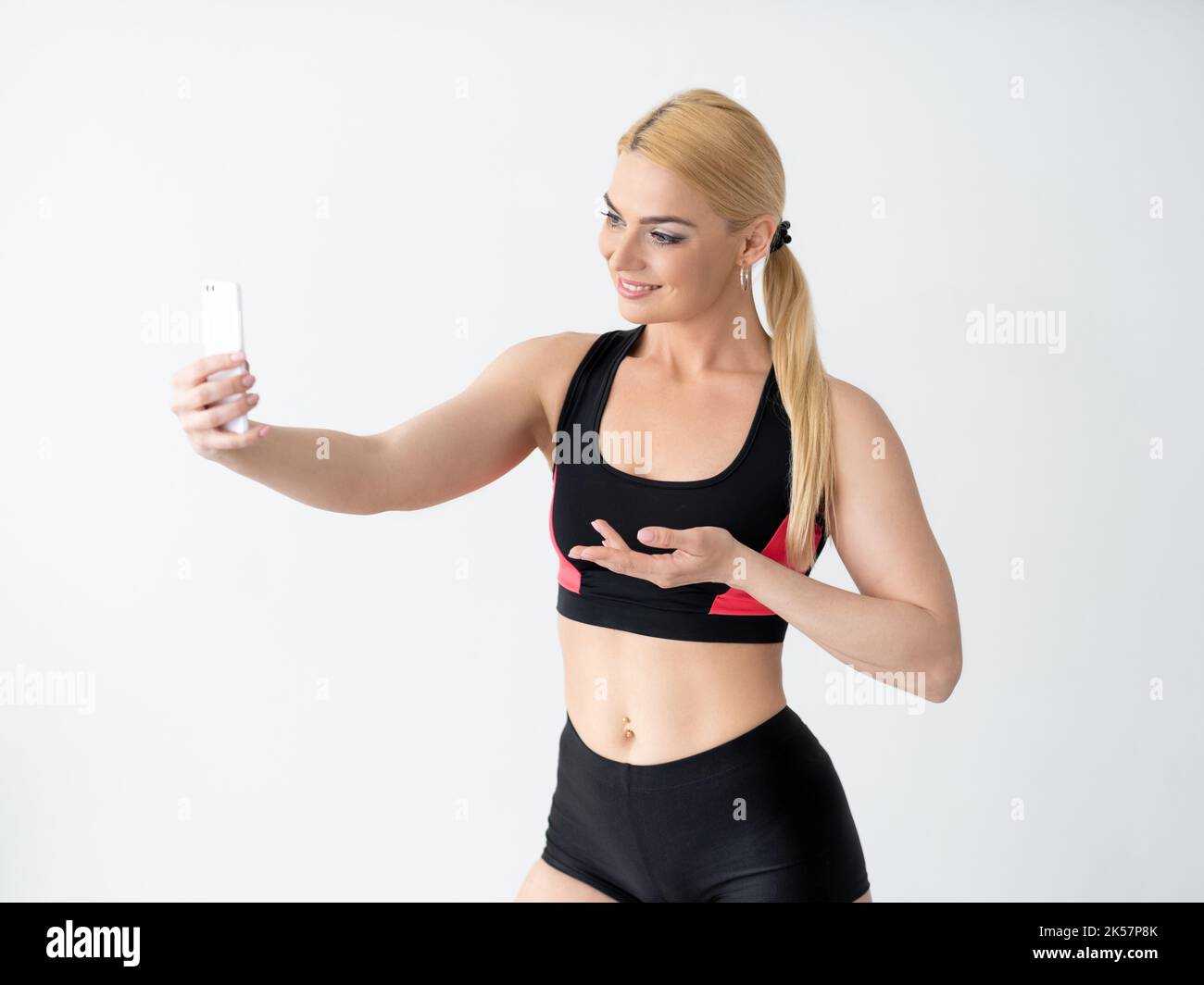 athletic woman promoting hand sport influence Stock Photo