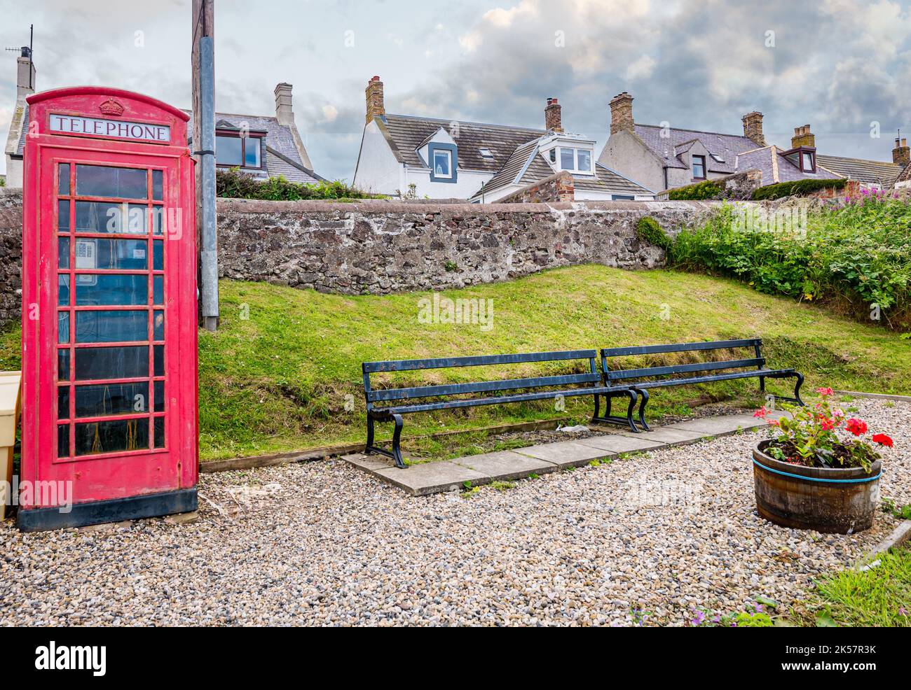 Traditional British red telephone box still in use, St Abb's village, Berwickshire, Scotland, UK Stock Photo