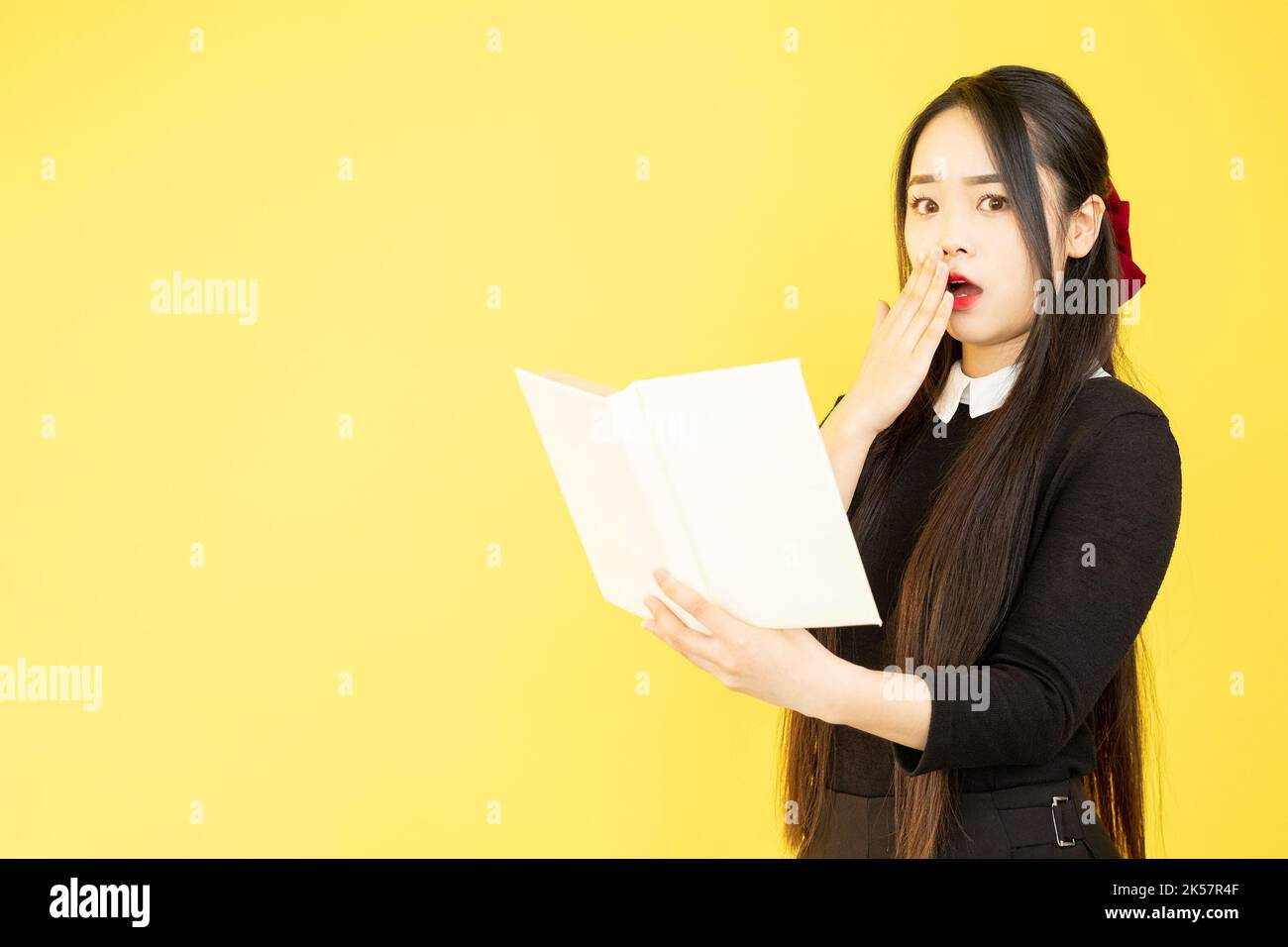 shocked student exam deadline worried girl book Stock Photo