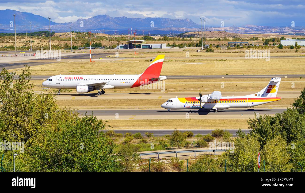 Madrid, Spain, October 30, 2022: Iberia aircraft circulating on the runways of Madrid Barajas airport. Stock Photo