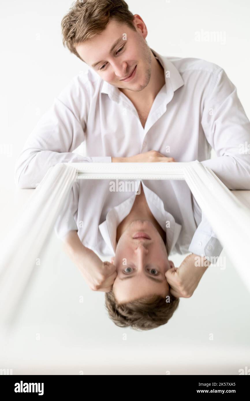 affected man inner conflict deception false Stock Photo