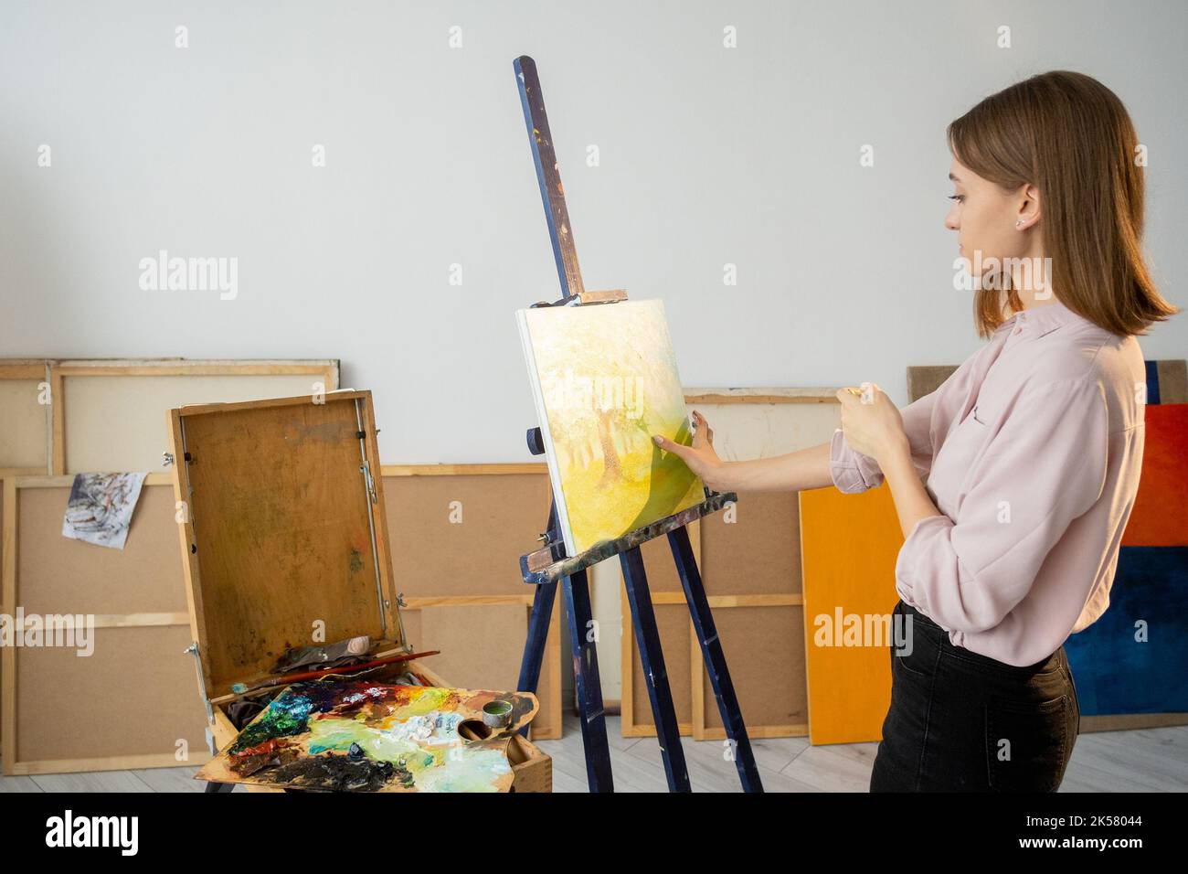 hand painting visual art artist working in studio Stock Photo