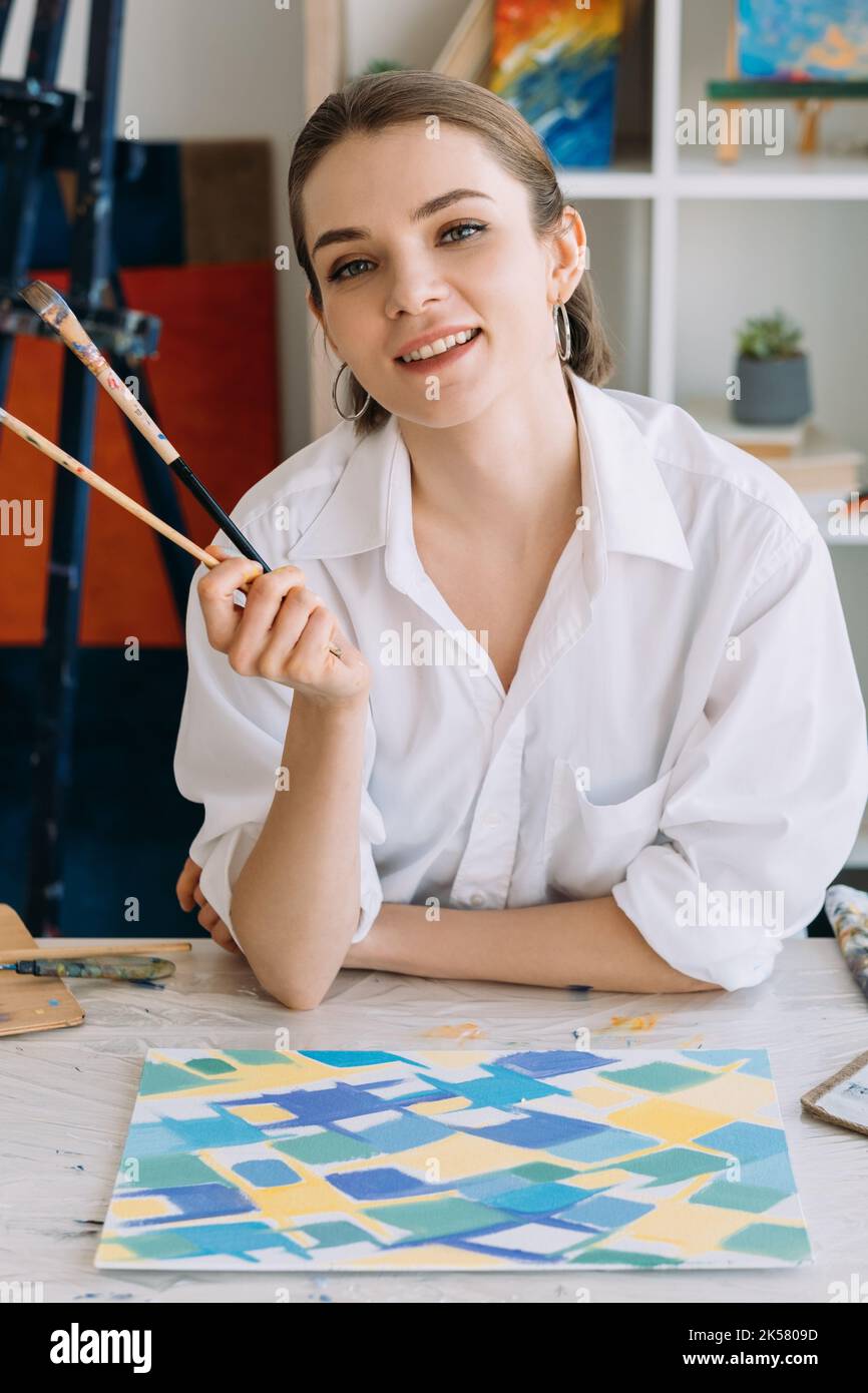 painting course modern art smiling female painter Stock Photo