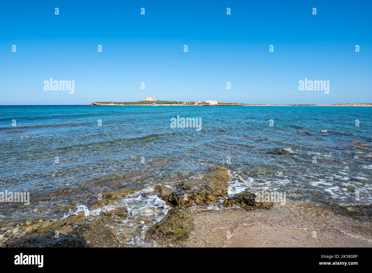 the beautiful sea of Portopalo with transparent and turquoise water with  the island of Capo Passero in the background Stock Photo - Alamy