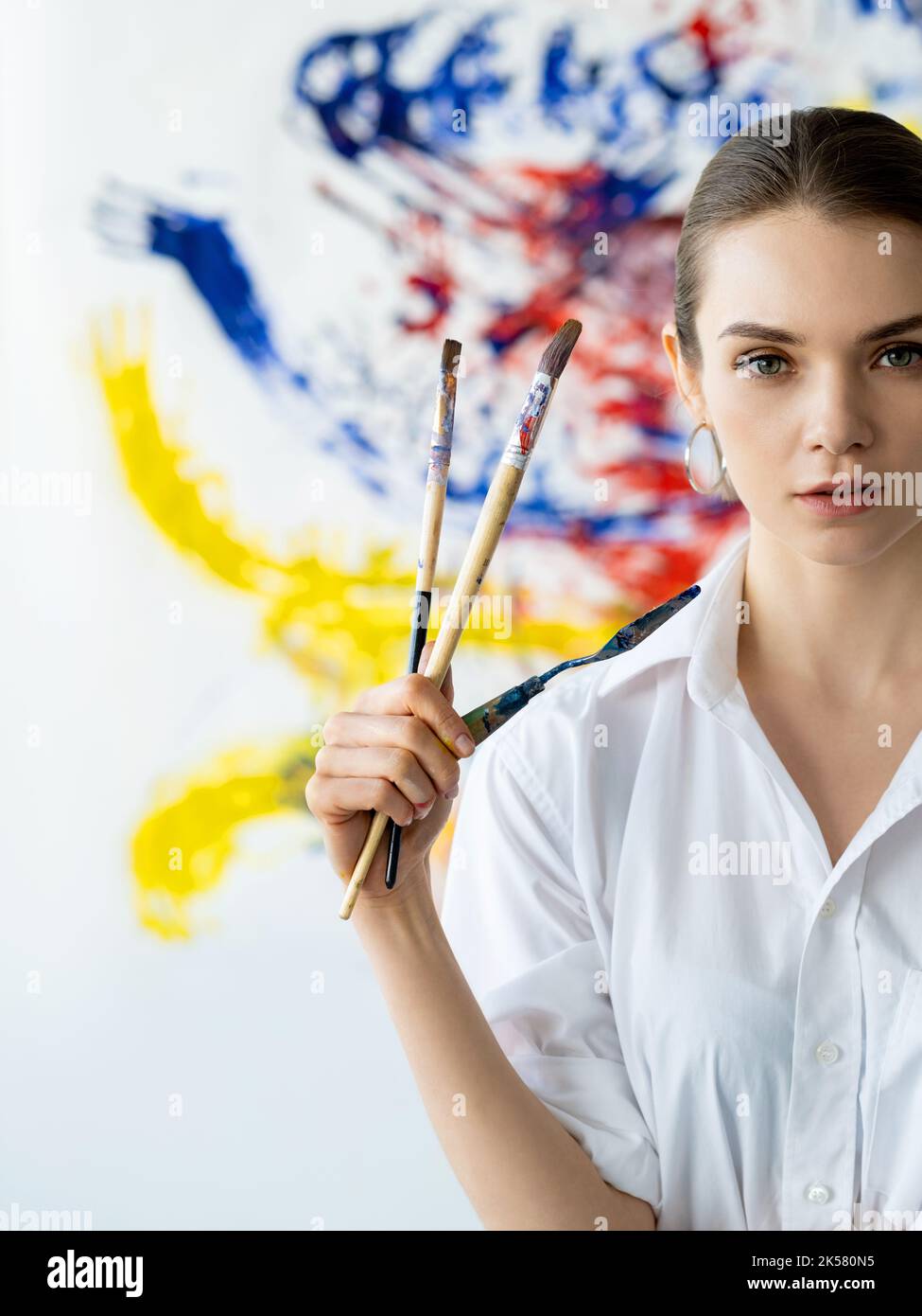 painter portrait visual art woman colorful wall Stock Photo