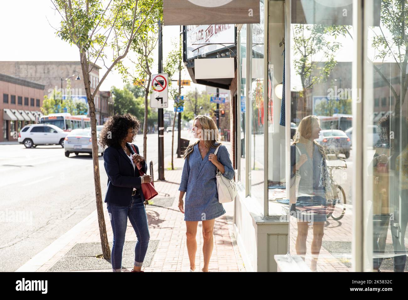 Two mature women friends walking hi-res stock photography and images ...