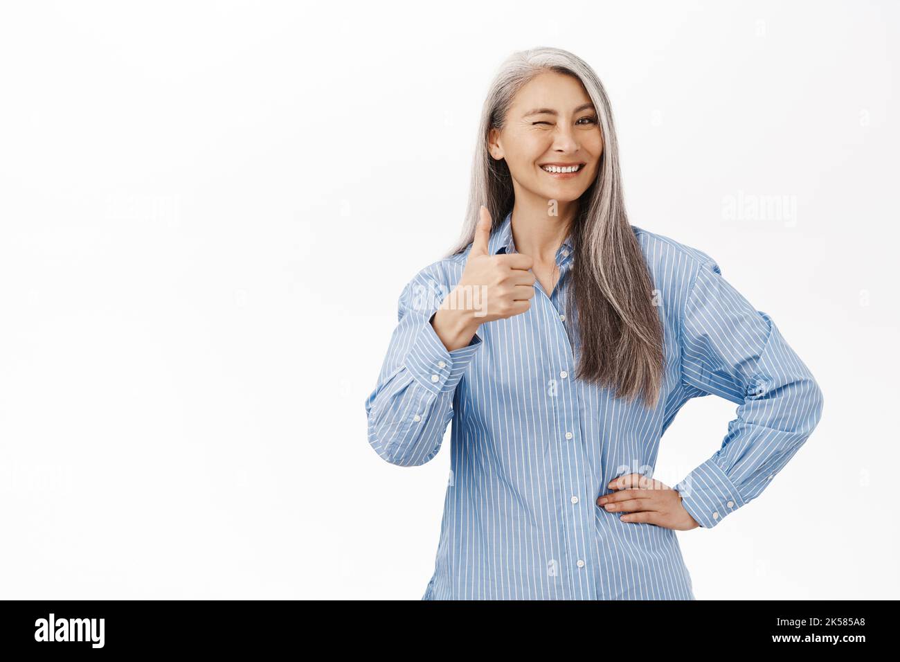 japanese granny Cheerful asian senior woman, japanese granny showing thumbs up in approval,  likes product, recommends brand, standing over white background Stock Photo  - Alamy
