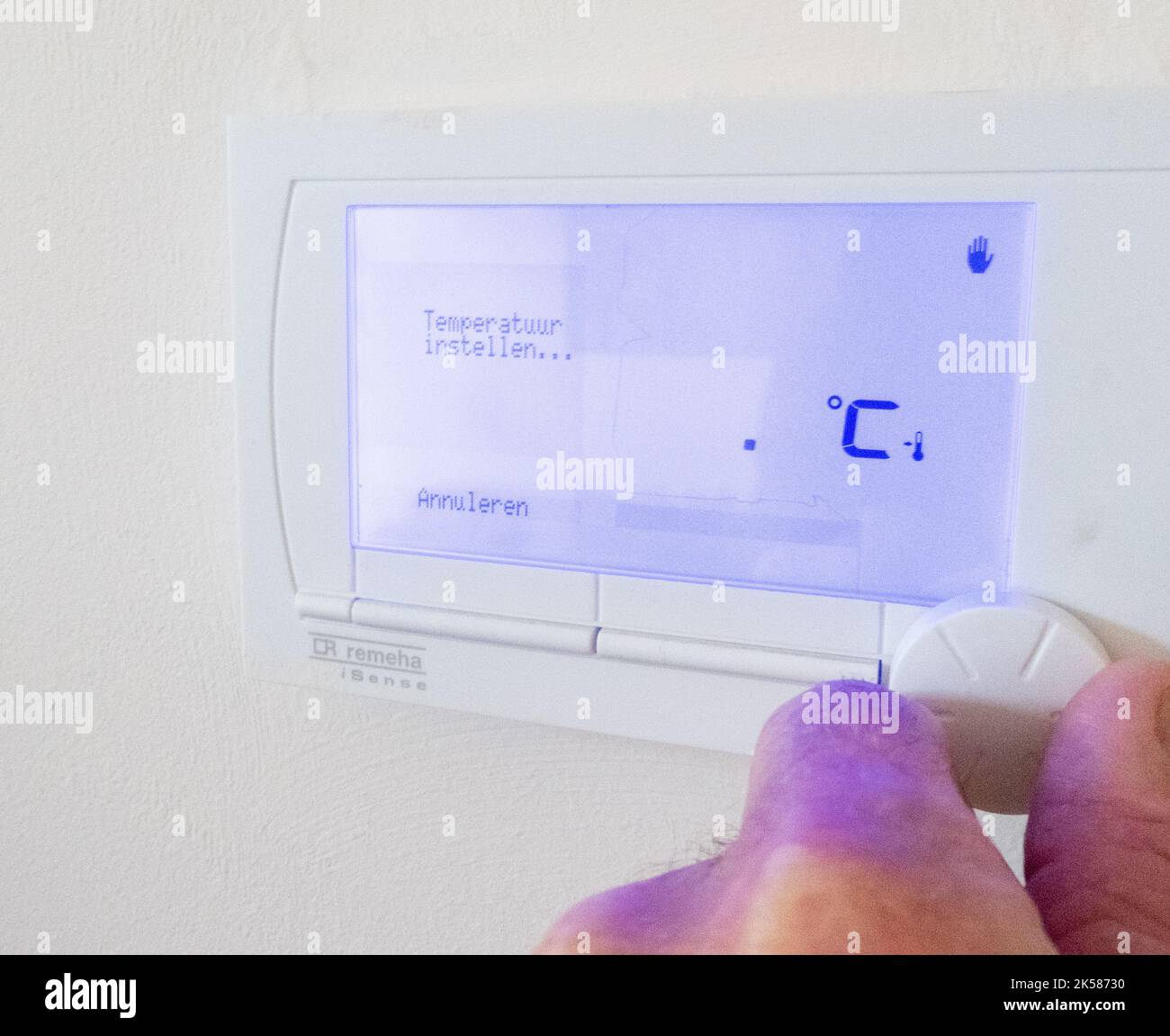 setting temperature of central heating at home in Holland Stock Photo