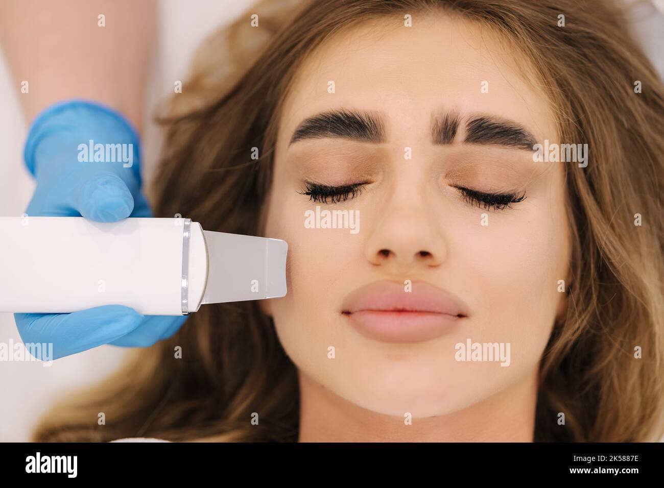 Woman peeling skin face hi-res stock photography and images - Alamy