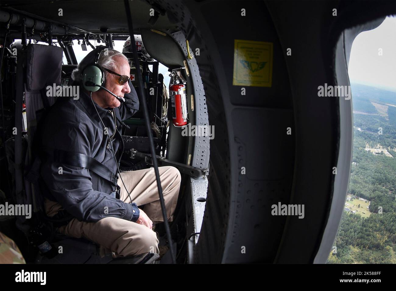 Georgetown, United States. 01 October, 2022. South Carolina Gov. Henry McMaster, assesses storm damage from a National Guard UH-60 helicopter in the aftermath of the Category 1 Hurricane Ian, October 1, 2022 in Georgetown, South Carolina. The storm surge from Hurricane Ian battered the Grand Strand region with high surf and winds. Stock Photo