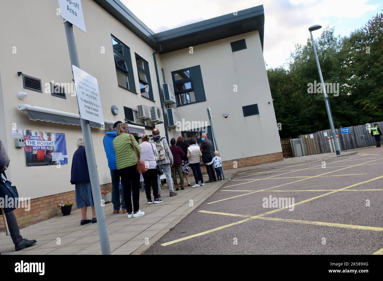 Felixstowe, Suffolk - 6 October 2022 : People queueing for flu and covid jabs at Grove Medical Centre. Stock Photo