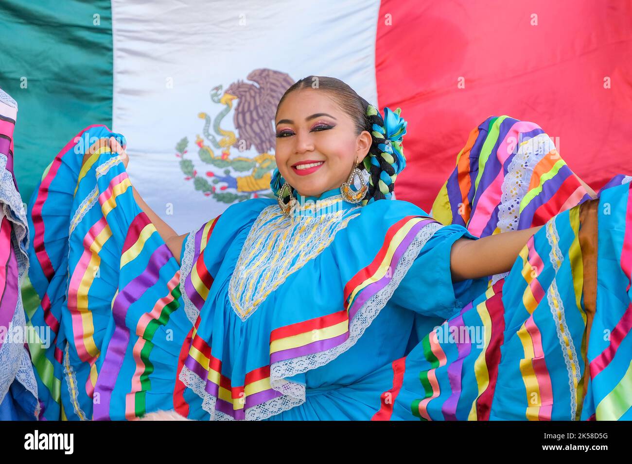 Antalya, Turkey - October 03 2022; Young brunette beautiful mexican traditional girl, folkloric dancer with colorful dresses. Stock Photo
