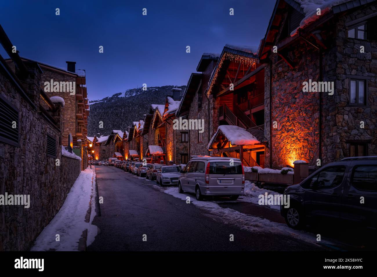 Modern stone houses and apartments illuminated by street lights in El ...