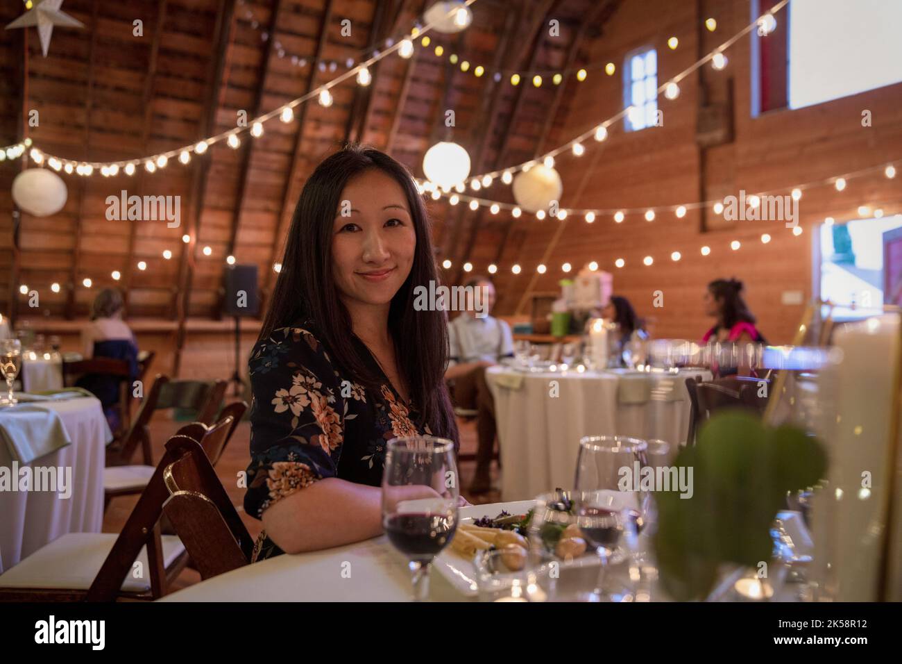 Portrait smiling female wedding guest enjoying wedding reception Stock ...