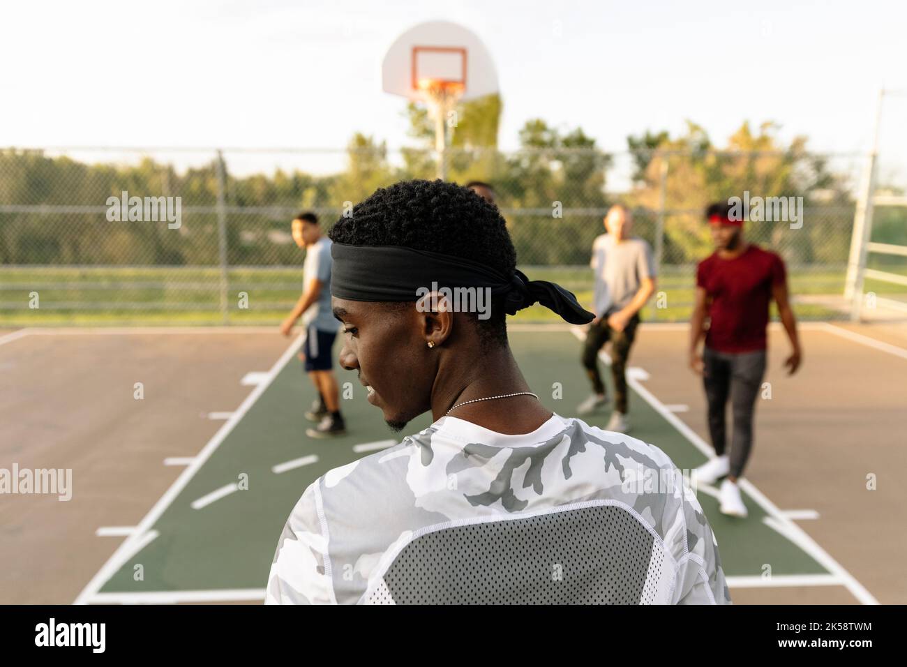 Rear view of basketball player wearing bandana Stock Photo Alamy