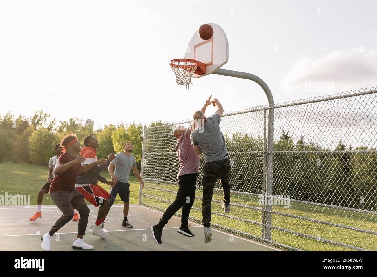 Basketball players scoring goal Stock Photo Alamy