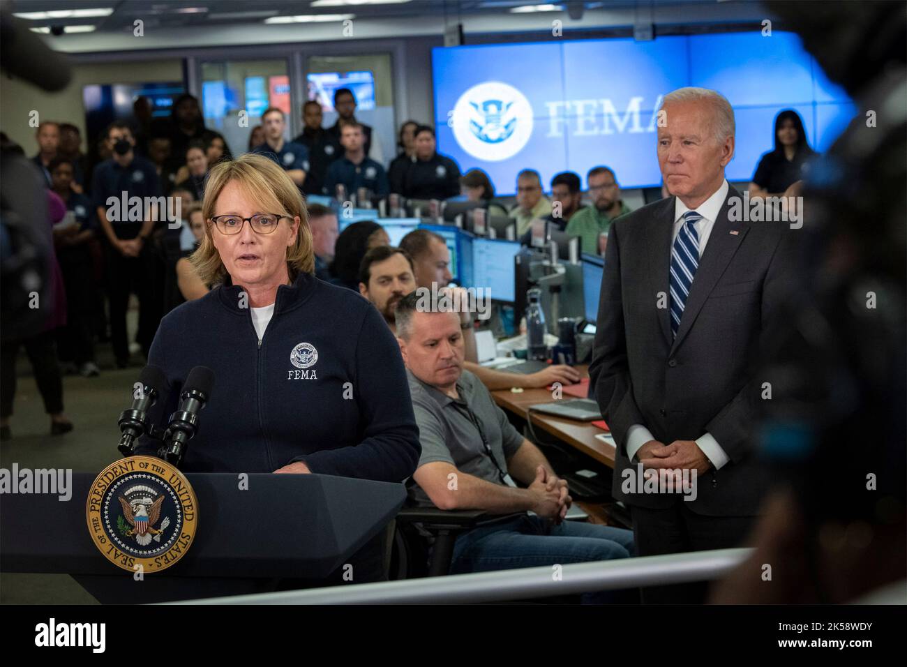 Washington, United States. 29 September, 2022. U.S. FEMA Administrator Deanne Criswell, left, delivers remarks during a briefing on Hurricane Ian as President Joe Biden, right, looks on at the Emergency Response Center inside FEMA headquarters, September 29, 2022, in Washington, D.C. Credit: Sydney Phoenix/Homeland Security/Alamy Live News Stock Photo