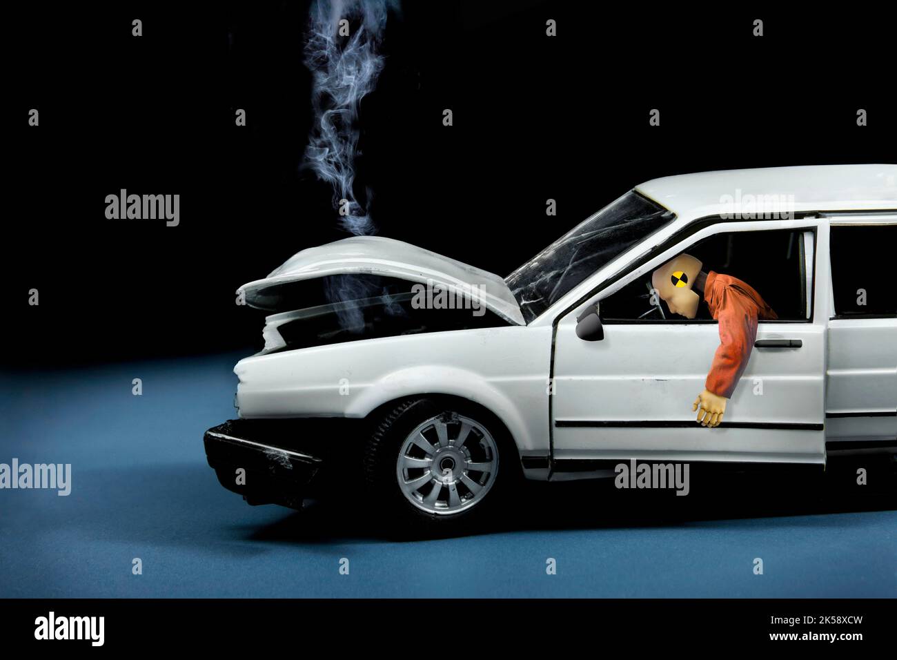 Crash test accident with dummy in model car Stock Photo