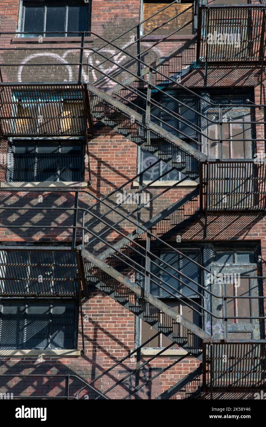 A metal stairway pn the exterior of an old building Stock Photo