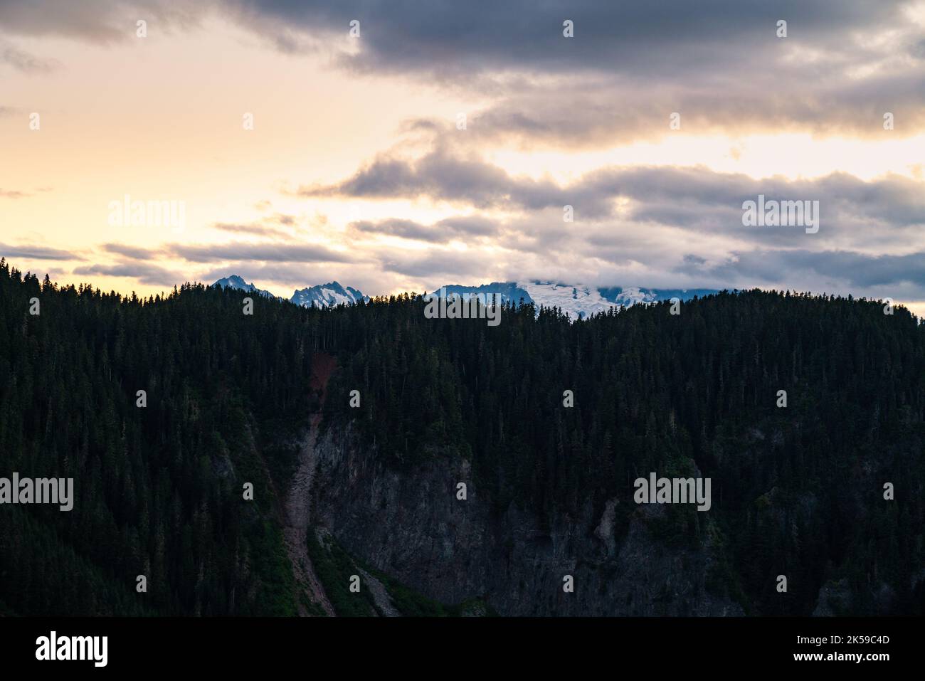 Twilight descends on the Panorama Ridge Trail with snow peaks piercing ...
