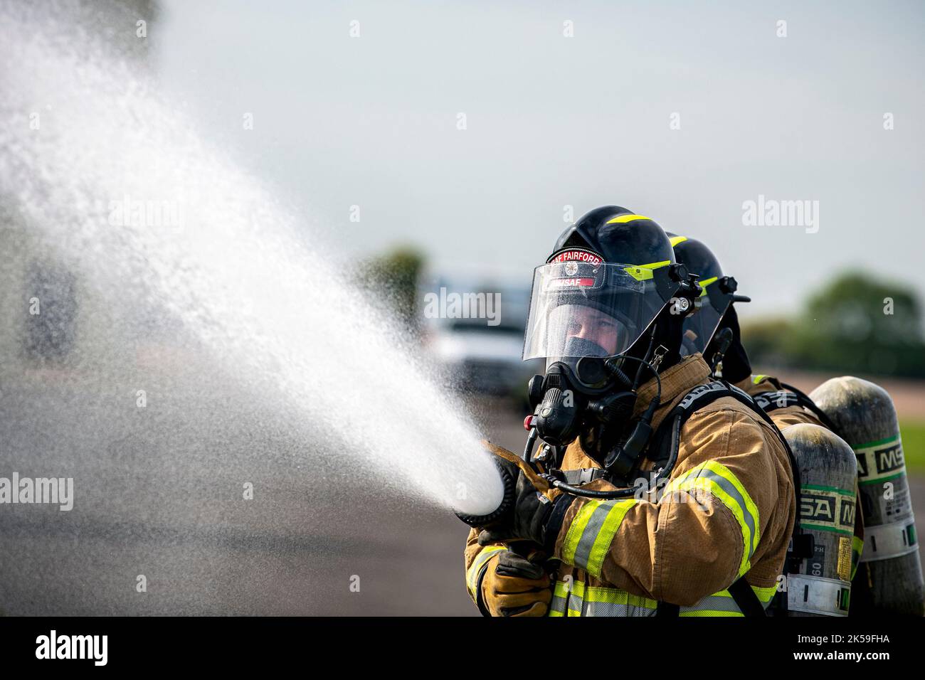 Firefighters from the 422d Fire Emergency Services extinguish an ...