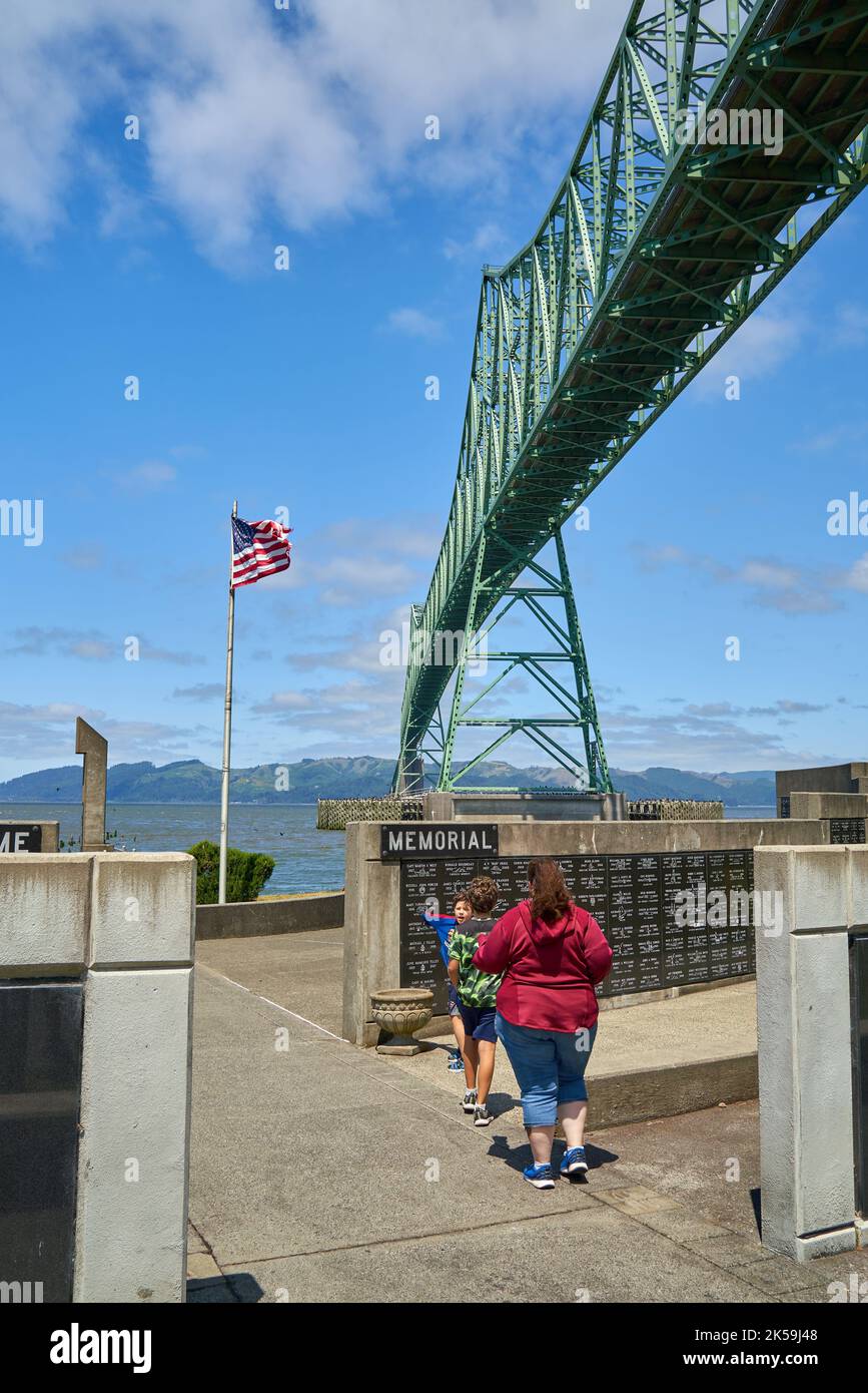 Mother and kids walking through a maritime memorial near the Astoria-Megler Bridge on the Columbia River, Astoria, Oregon. Stock Photo