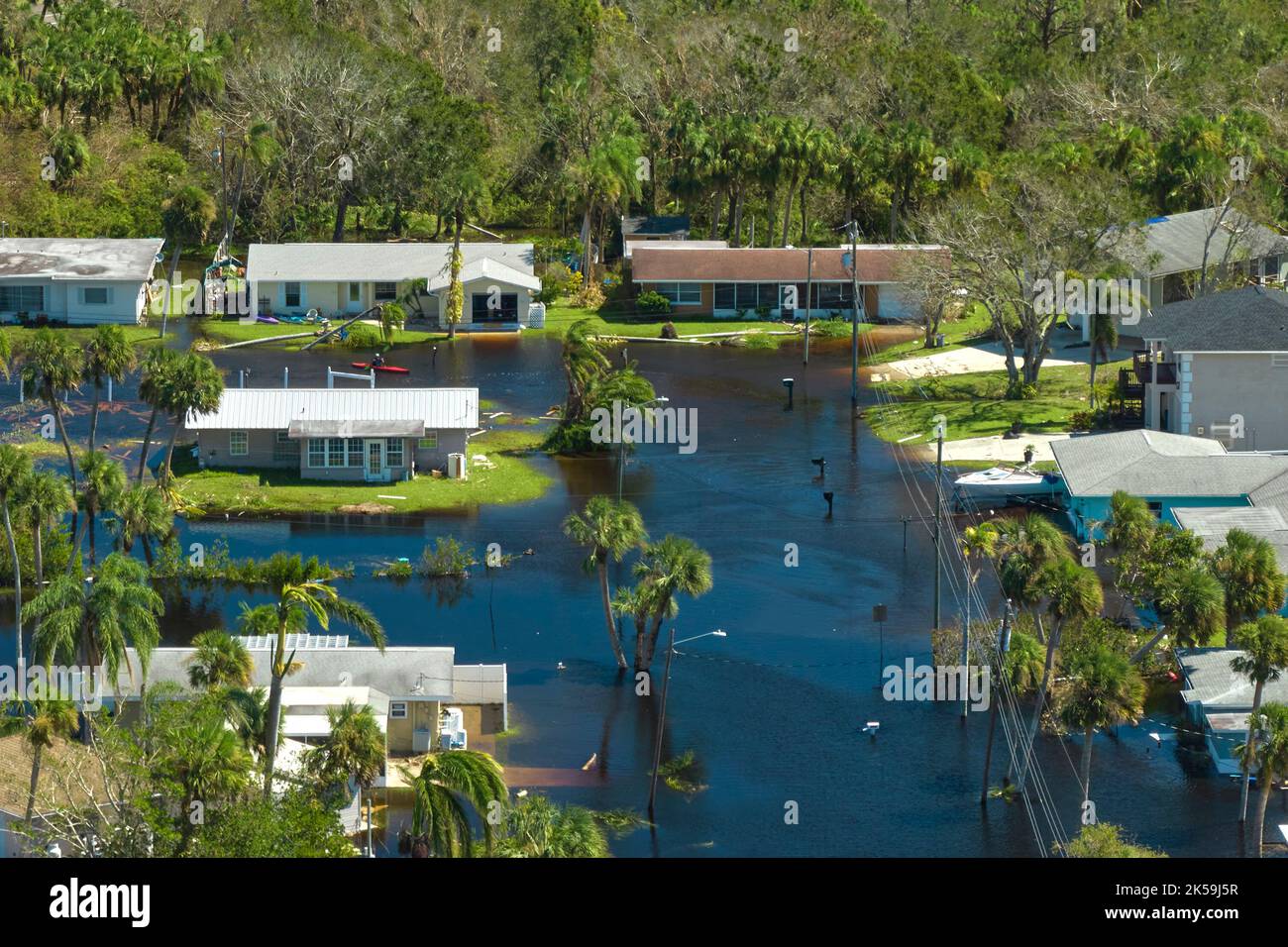 Hurricane Ian flooded houses in Florida residential area. Natural disaster and its consequences