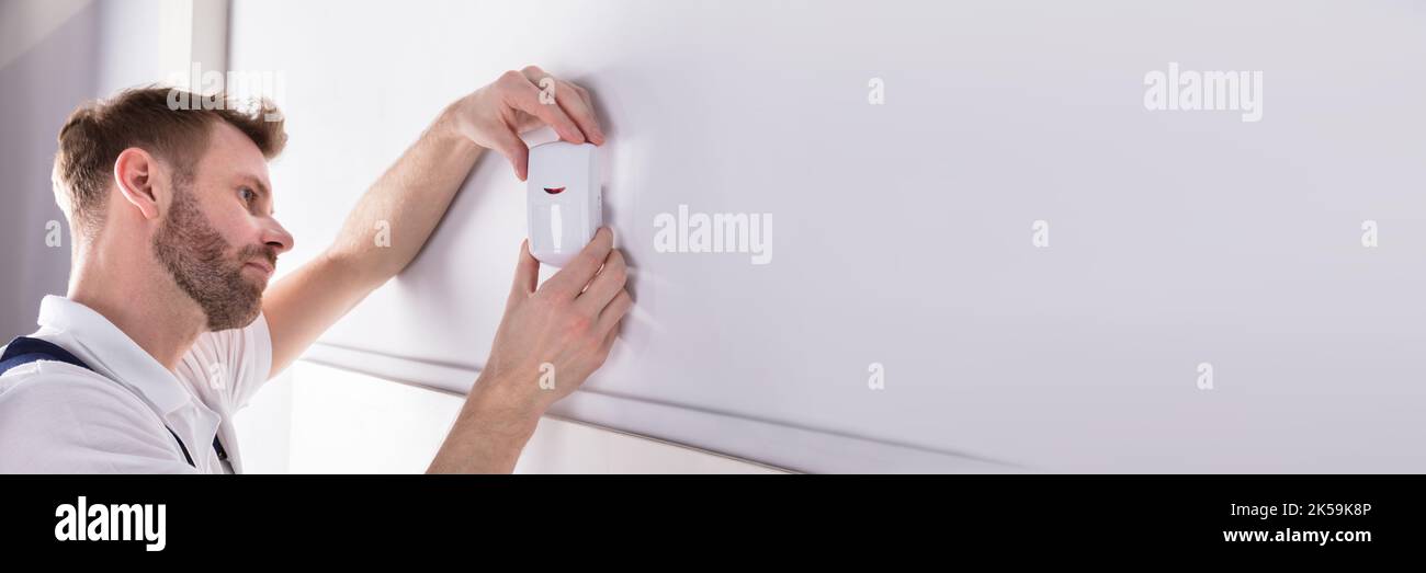 Security System Alarm Sensor. Electrician Man Repair Stock Photo Alamy