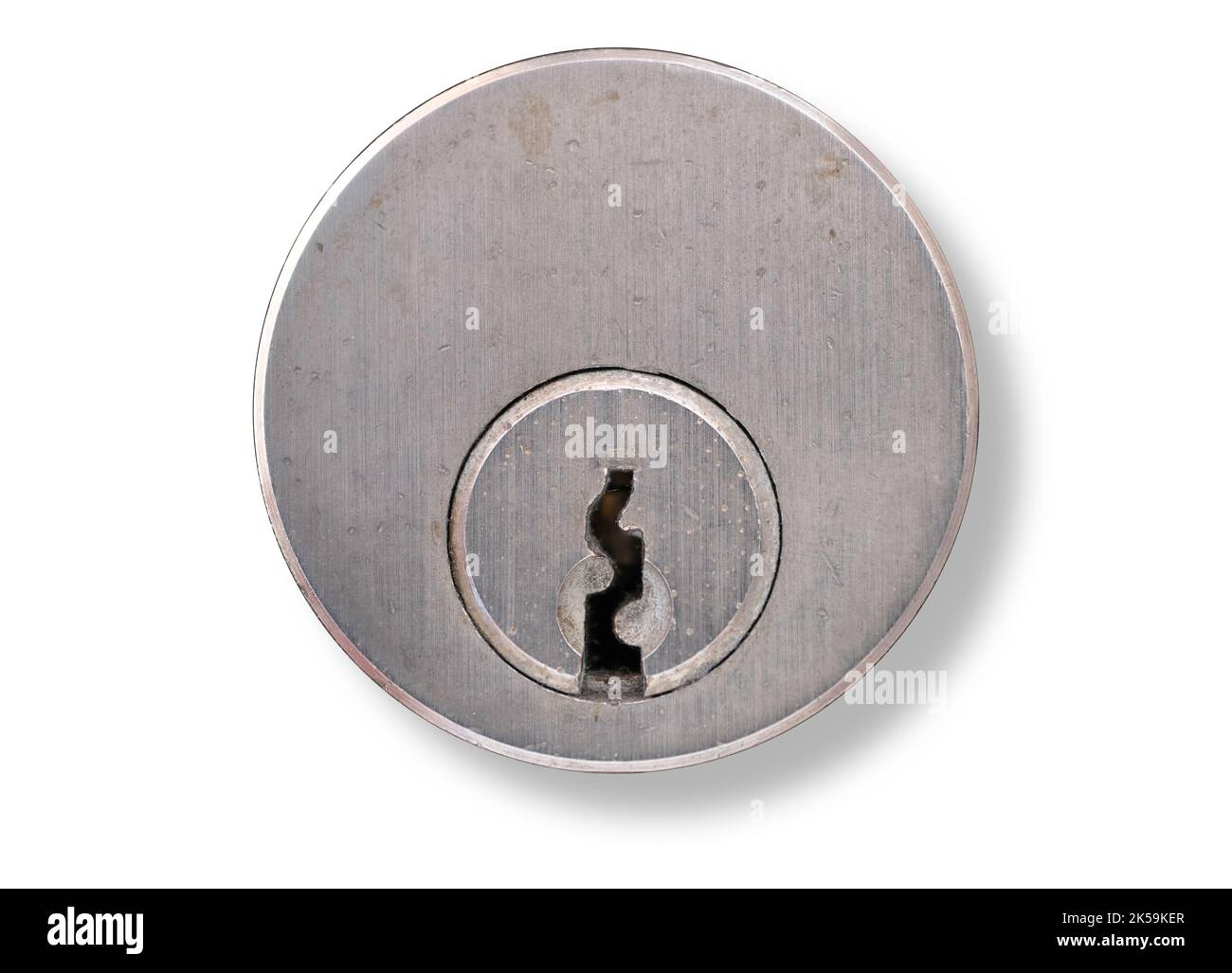 Metal key plate with keyhole of a cylinder lock in a door with dropdown