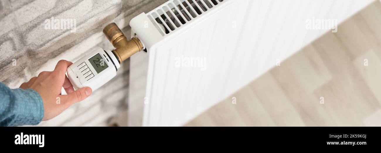 Home Radiator Thermostat Valve. House Temperature Control Stock Photo