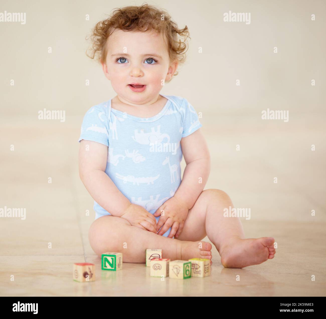 Learning is fun for a curious little boy. Full length shot of a cute baby boy playing with toy