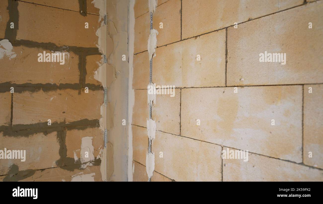 Wall repair. Fastening metal strips to the wall. Preparing walls for