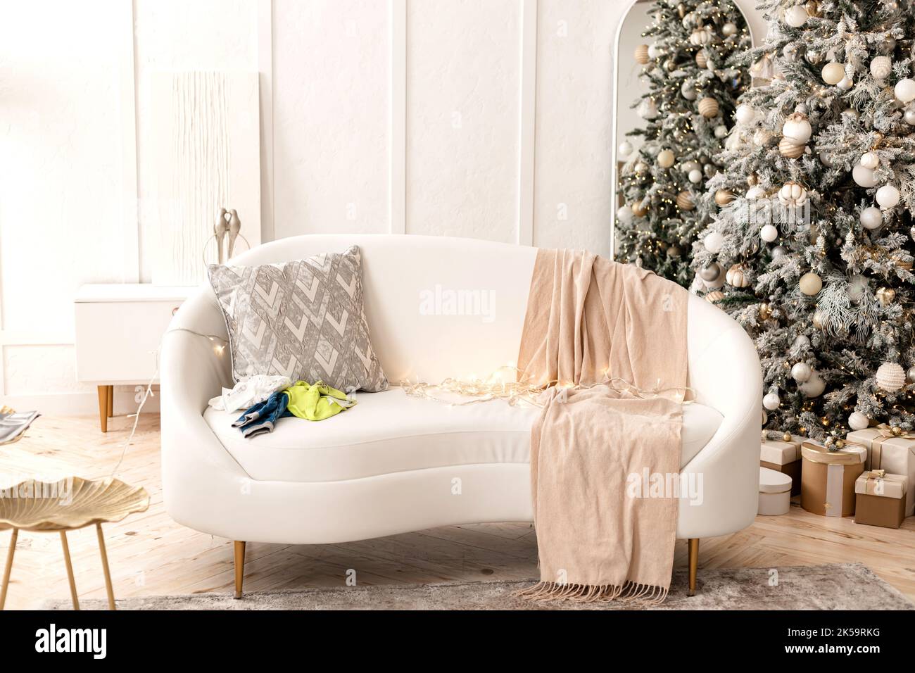 White sofa in the living room. Christmas Tree. New Year Stock Photo