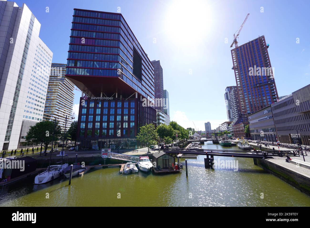 ROTTERDAM, NETHERLANDS - JUNE 9, 2022: Rotterdam cityscape with canal on sunny day, Netherlands Stock Photo