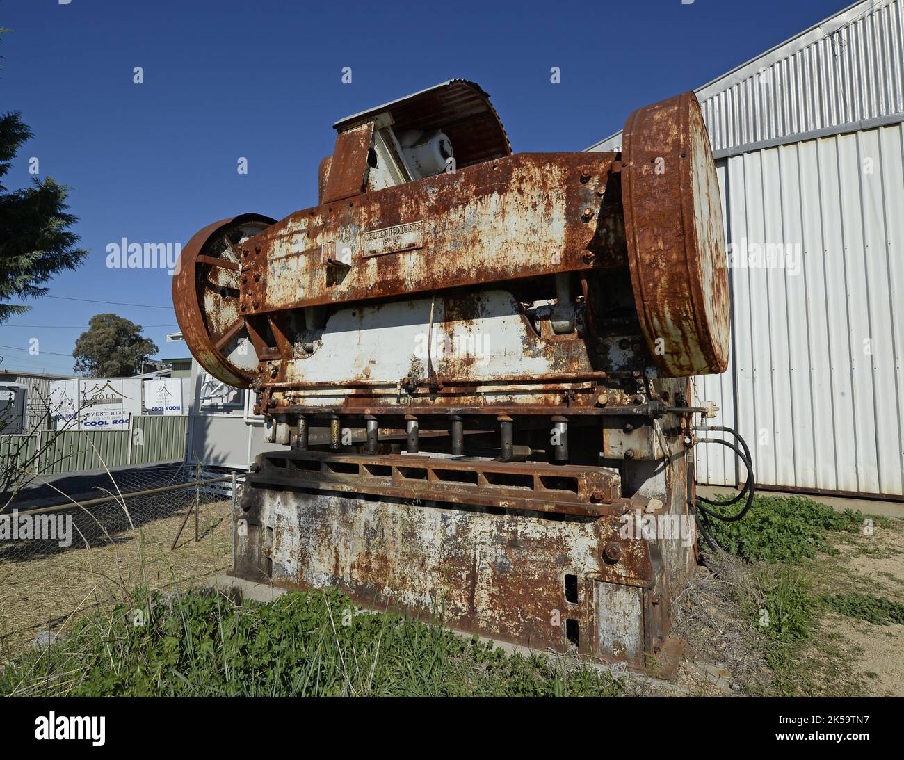 Old sheet steel bending machine outside old factory in Inverell, new south wales, australia Stock Photo