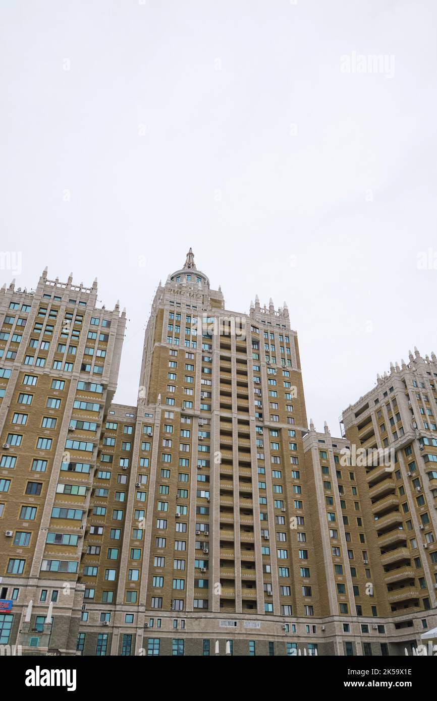 Cloudy, grey view of the looming, iconic Triumph Towers, modeled after