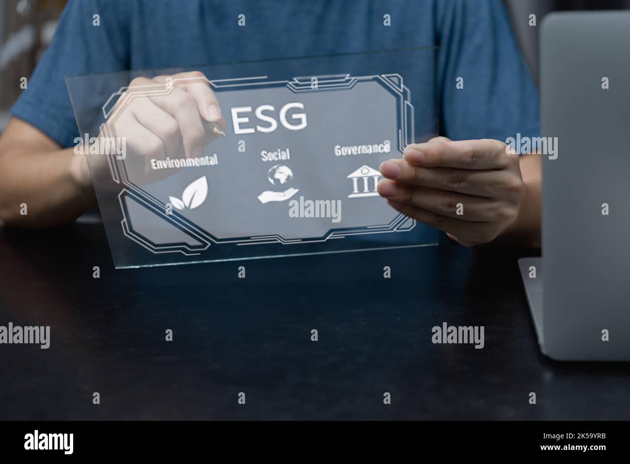 Businessman touching screen virtual icon ESG Environmental social and governance eco energy sustainable digital investment Organizational growth techn Stock Photo