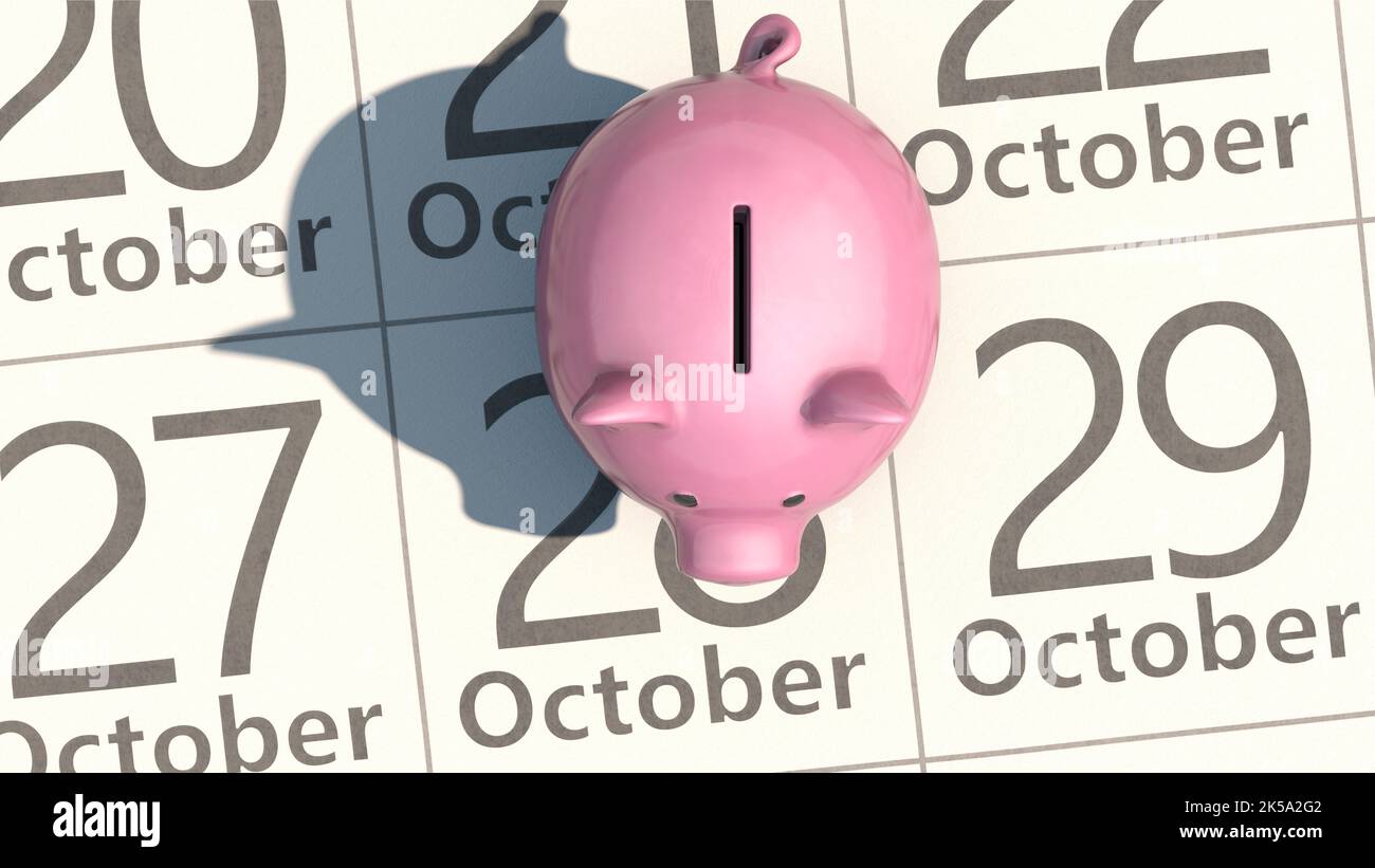 Empty piggy bank stands on calendar sheet Stock Photo
