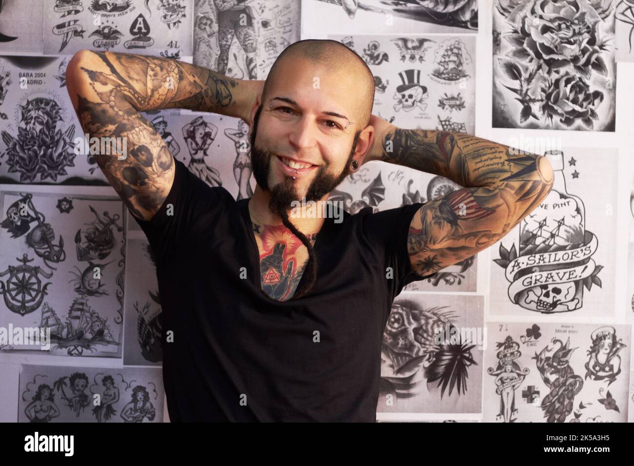 Every tattoo has a story to tell. a youngm an with tattoos. Stock Photo