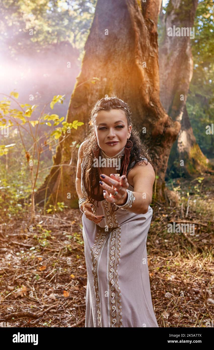 girl in a dress walks in a mysterious forest Stock Photo - Alamy