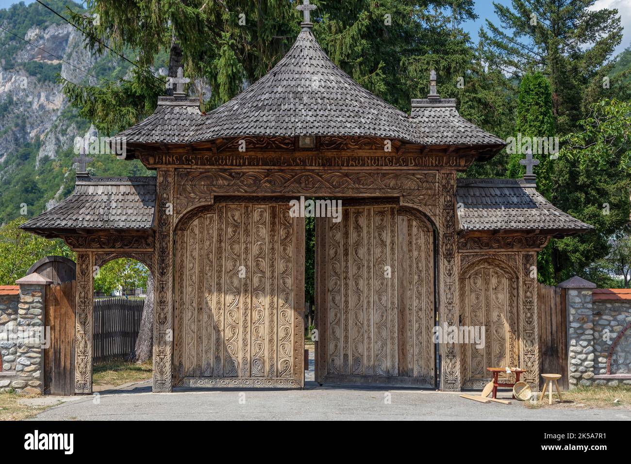 The wooden gate of the Polovragi Monastery, Gorj, Romania. The monastery is an old architectural monument from Gorj county. Stock Photo