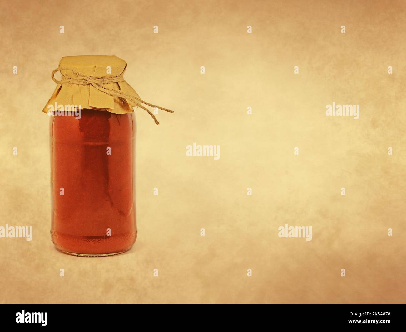 Jar of tomato paste on old paper background Stock Photo Alamy