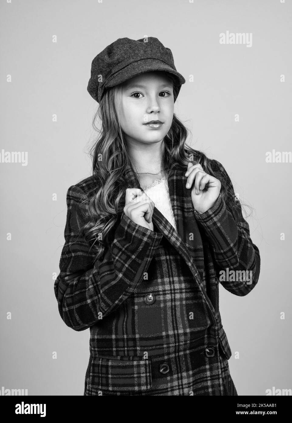 kid in cap with stylish hairstyle wear checkered jacket, childhood